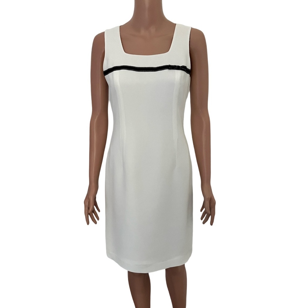 White dress with black stitched ribbon bow by Petite Sophisticate.